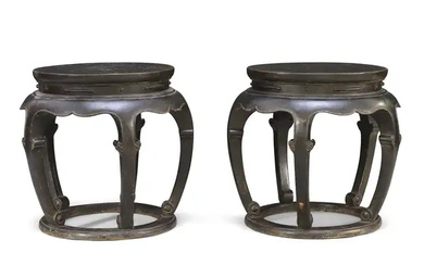 A pair of large Chinese black lacquer drum form stools, Late Ming...