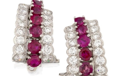 A pair of ruby and diamond ear clips, the central row of claw-set circular-cut rubies flanked by two graduated rows of brilliant-cut diamonds, clip fittings, approx. length 1.7cm (VAT charged on hammer price)