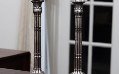 A pair of sterling silver candlesticks with fluted columns to stepped base, Height 31.5cm, hallmarked London, c.1772 by John Scofield, lightly loaded bases, total wt. 1550g