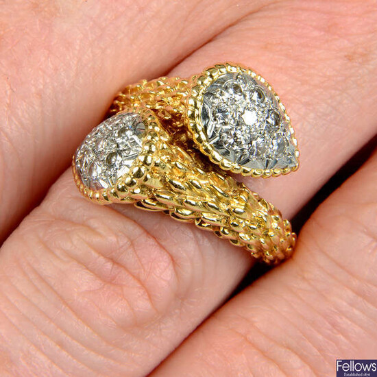 A pavé-set diamond textured crossover dress ring.