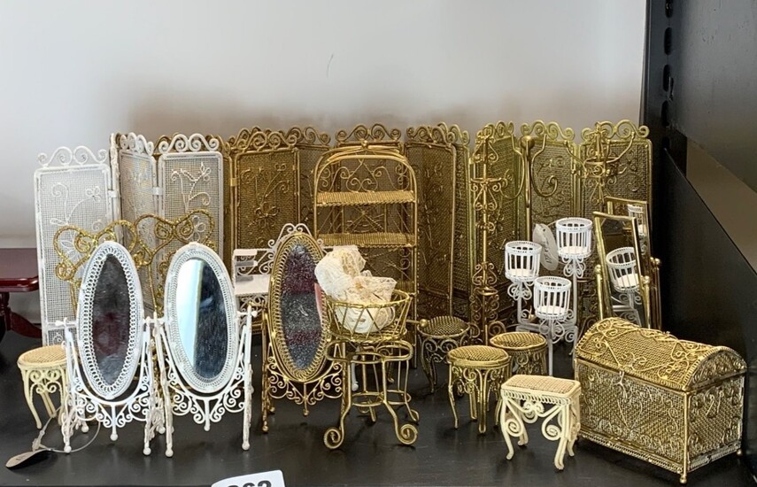 A quantity of painted metal dolls house boudoir furniture.