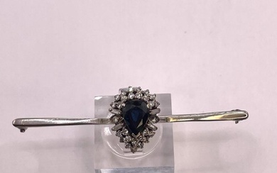 A sapphire and diamond bar brooch, Featuring a pear-shaped sapphire...
