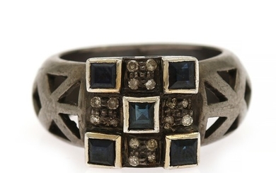 A sapphire and diamond ring set with five square-cut sapphires and numerous single-cut diamonds, mounted in silver. Size 57.