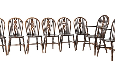 A set of eight beech and elm wheel back dining chairs