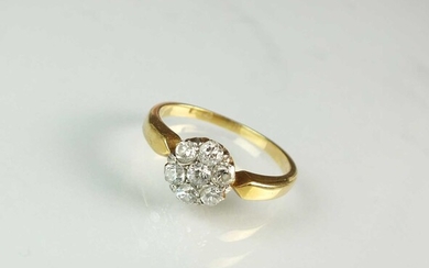A seven stone diamond floral cluster ring
