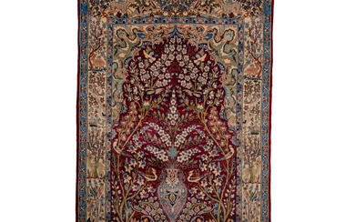 A silk Isphahan rug depicting a flower vase, signed, 175 x 113,5 cm