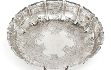 A silver strawberry dish, London, 1928, Manoah Rhodes & Sons, the fluted sides and base chased with foliate scroll decoration, 21.5cm dia., 4.9cm high, approx. weight 17.1oz