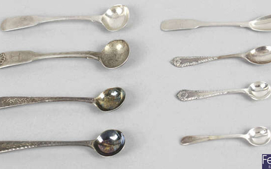 A small collection of salt and mustard spoons.