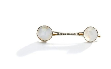 A star sapphire and diamond bar brooch, by FabergÃ©