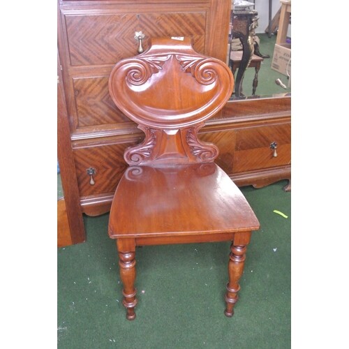 A stunning antique/ Victorian carved shield back hall chair.