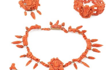 A suite of carved coral jewellery, comprising a necklace, bracelet,...