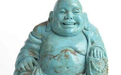 A turquoise sculpture depicting a smiling Buddha. Dimensions 69.7 x...