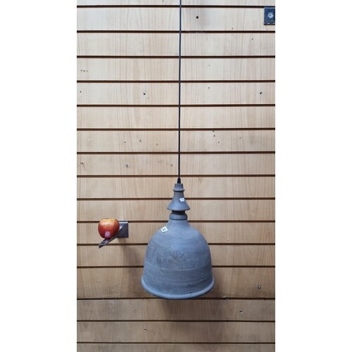 A usual soft turned wooden bell shaped ceiling lamp by a Bri...