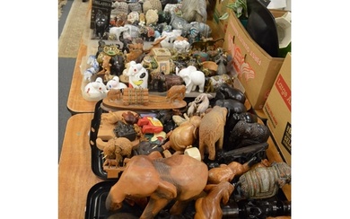 A very large collection of elephants comprising wooden, porc...