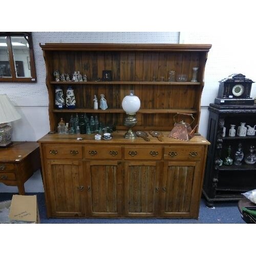A vintage pine Dresser, the two-tier plate rack set on a bas...