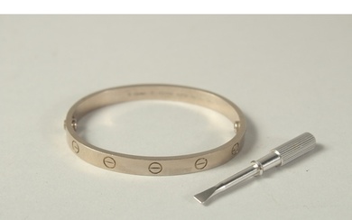 AN 18CT WHITE GOLD CARTIER BANGLE with screwdriver, No. GSD...