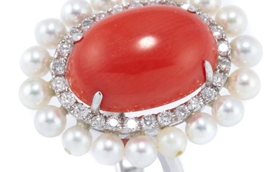 AN 18CT WHITE GOLD CORAL DIAMOND AND PEARL COCKTAIL RING; featuring a 5.8ct oval cabochon coral (13.9 x 9.8mm) four claw set above a...