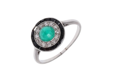 AN EMERALD, DIAMOND AND BLACK ONYX CLUSTER RING. centred wit...