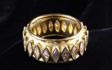 An 18 Carat Yellow Gold & Diamond Band Ring. The sandblasted finish band with outer polished rims, a