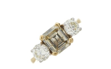 An 18ct gold coloured diamond and diamond three-stone ring