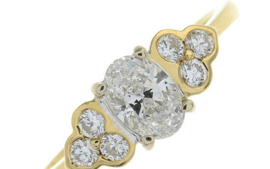An 18ct gold oval and brilliant-cut diamond dress ring.
