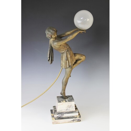 An Art Deco patinated spelter table lamp, early 20th century...