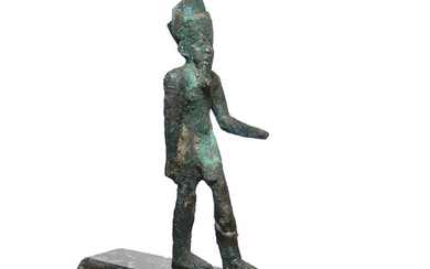 An Egyptian bronze striding figure of Amun
