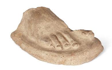 An Etruscan terracotta right foot, Circa 3rd-2nd Century B.C. Either votive or from statue, with well modelled toes, 22cm long Provenance: UK auction, acquired in September 2017; previously part of the Gross collection, acquired at a UK auction...