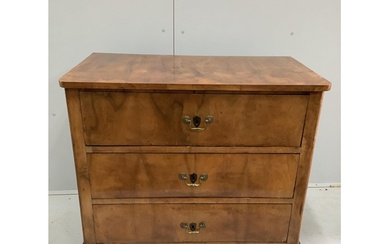 An early 19th century Continental walnut three drawer chest,...