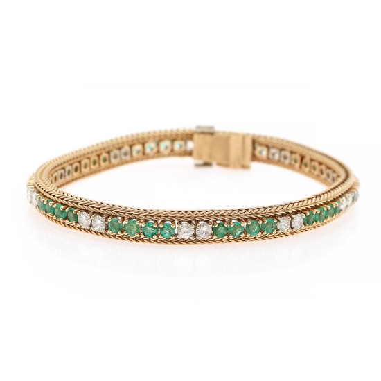 An emerald and diamond bracelet set with numerous circular-cut emeralds and brilliant-cut diamonds, mounted in 18k gold. Circa 1950–1960. L. 18.5 cm.