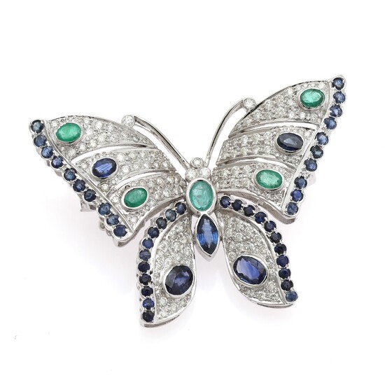 NOT SOLD. An emerald, sapphire and diamond brooch set with five emeralds, numerous sapphires encircled...
