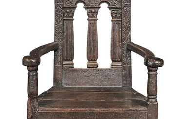 An interesting James VI/I oak caqueteuse open armchair, Scottish, circa 1600