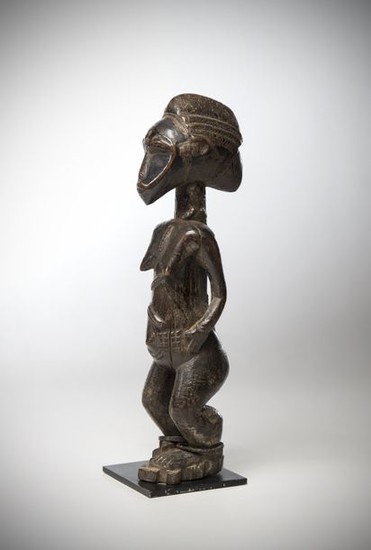 BAOULE, Ivory Coast. Female statue with elongated face...