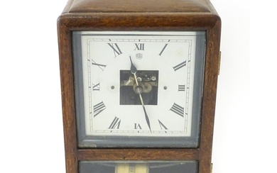 Bulle : A French Art Deco oak cased electric mantel clock by...