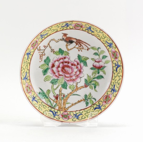 CHINESE FAMILLE ROSE PORCELAIN DISH With central peony and phoenix decoration surrounded by a famille jaune border. Six-character Qi...