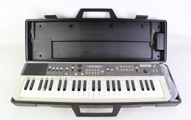 Cased Casio Organ