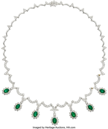 Emerald, Diamond, White Gold Necklace Stones: Oval-shaped emeralds weighing...