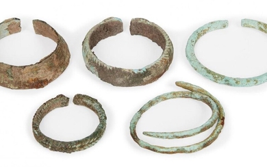Five Chinese bronze bracelets, Neolithic period, three with woven decoration,...