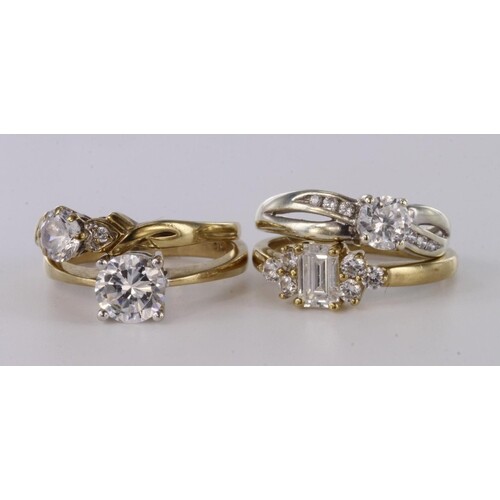 Four 9ct yellow gold cz set dress rings, total weight 9.1g