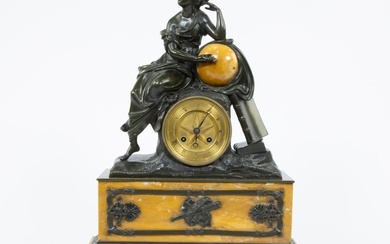 French Empire mantle clock in yellow marble decorated with classical lady resting on a globe, marked with stamp Medaille d'or Lans and dated 1827.