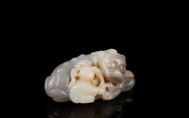 GREYISH-GREEN JADE CARVING OF A MYTHICAL BEAST AND BOY 19TH-20TH CENTURY