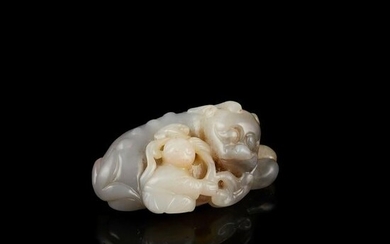 GREYISH-GREEN JADE CARVING OF A MYTHICAL BEAST AND BOY
