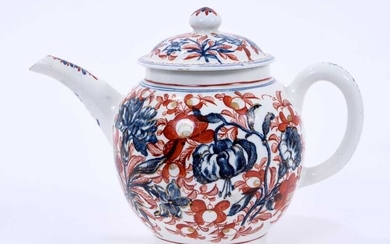 Lowestoft teapot and cover, of globular form with a straight spout and mushroom finial, printed in blue with large scale flower specimens including lilies and carnations, over painted around with f...