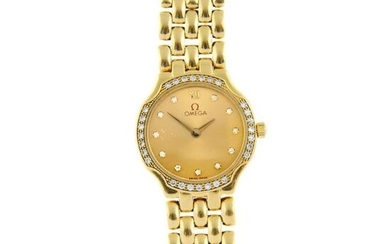 OMEGA - a bracelet watch. Yellow metal case, stamped 18K, with factory diamond set bezel. Case width