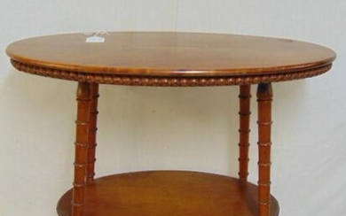 Oval maple side table with spool legs & lower shelf