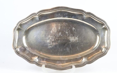 Oval silver platter, with curved edges.
