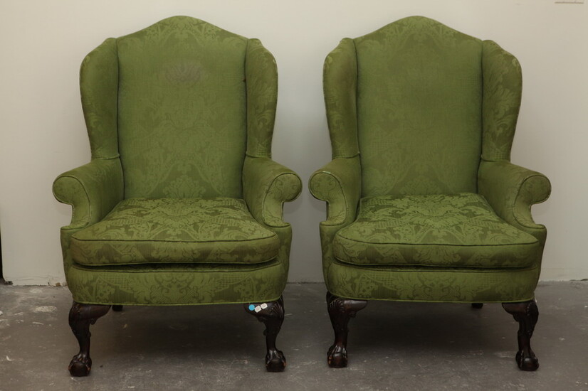 PAIR CHIPPENDALE STYLE CARVED MAHOGANY UPHOLSTERED WING CHAIRS. Ball-and-claw feet...