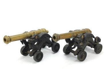 Pair of early 20th century bronze and cast iron cannons, eac...
