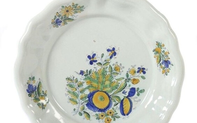 Plate with flower painting Probably 18th century, sand-coloured body, on the greyish glaze in harshness flower painting, flower bouquet in the mirror, scattered flowers on the raised, several times waved flag, bottom side in black onglaze colour...