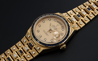 ROLEX "MECCANO" REF. 19168, A GOLD DAY-DATE OYSTERQUARTZ SET WITH DIAMONDS AND SAPPHIRES
